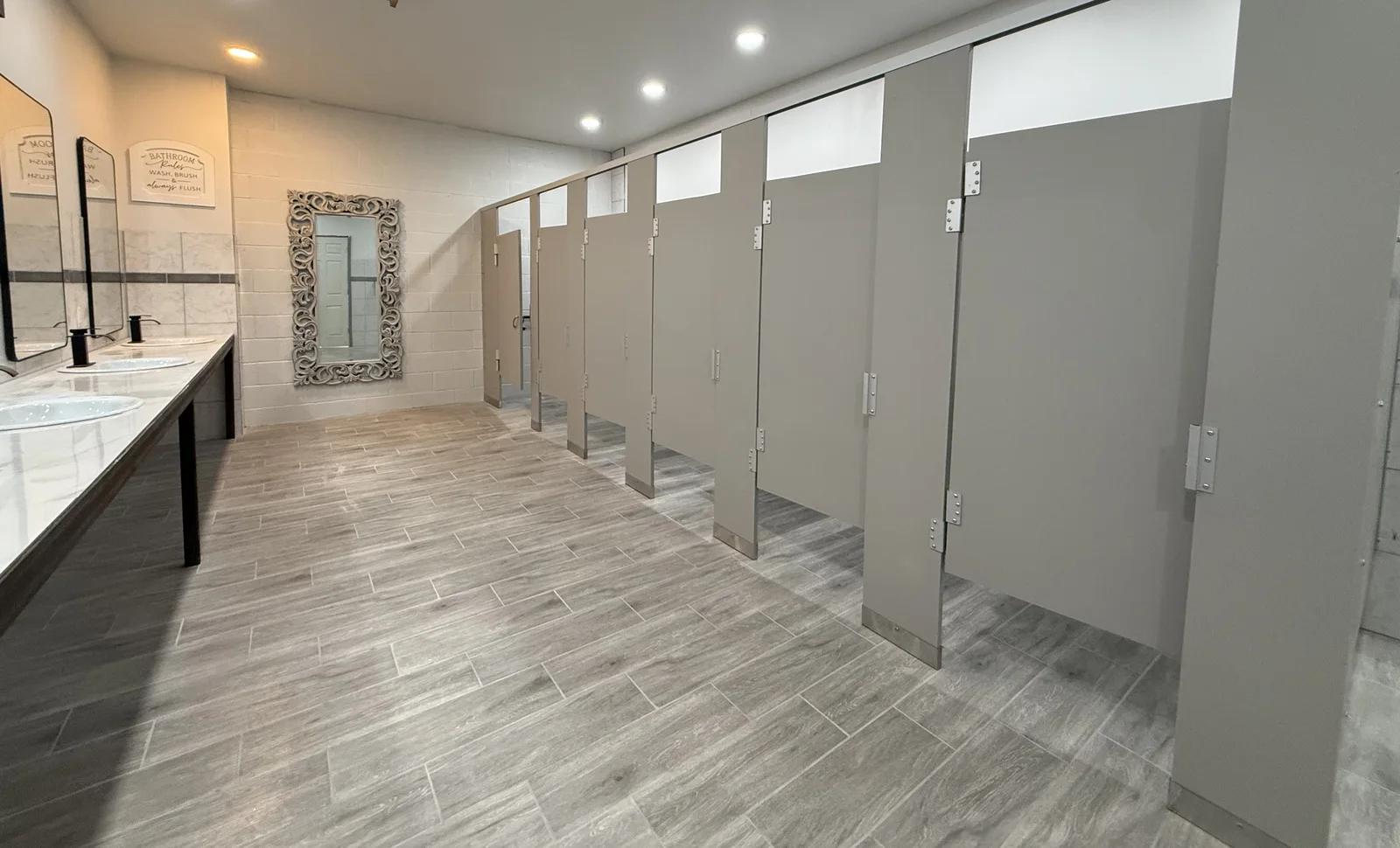 Private bathhouse stalls with wood doors