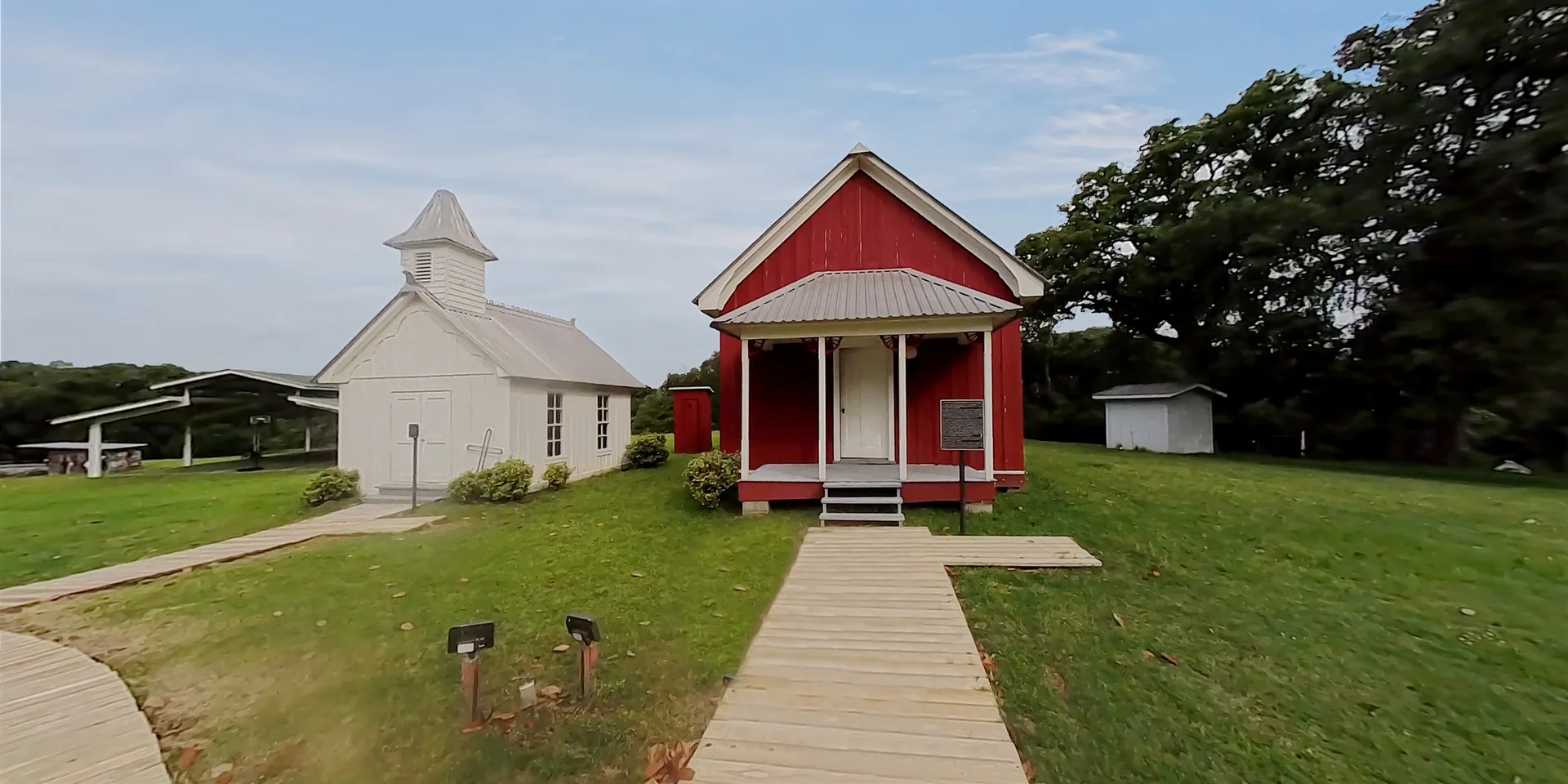 Path between ranch buildings and the little white church at Twin Oaks Resort