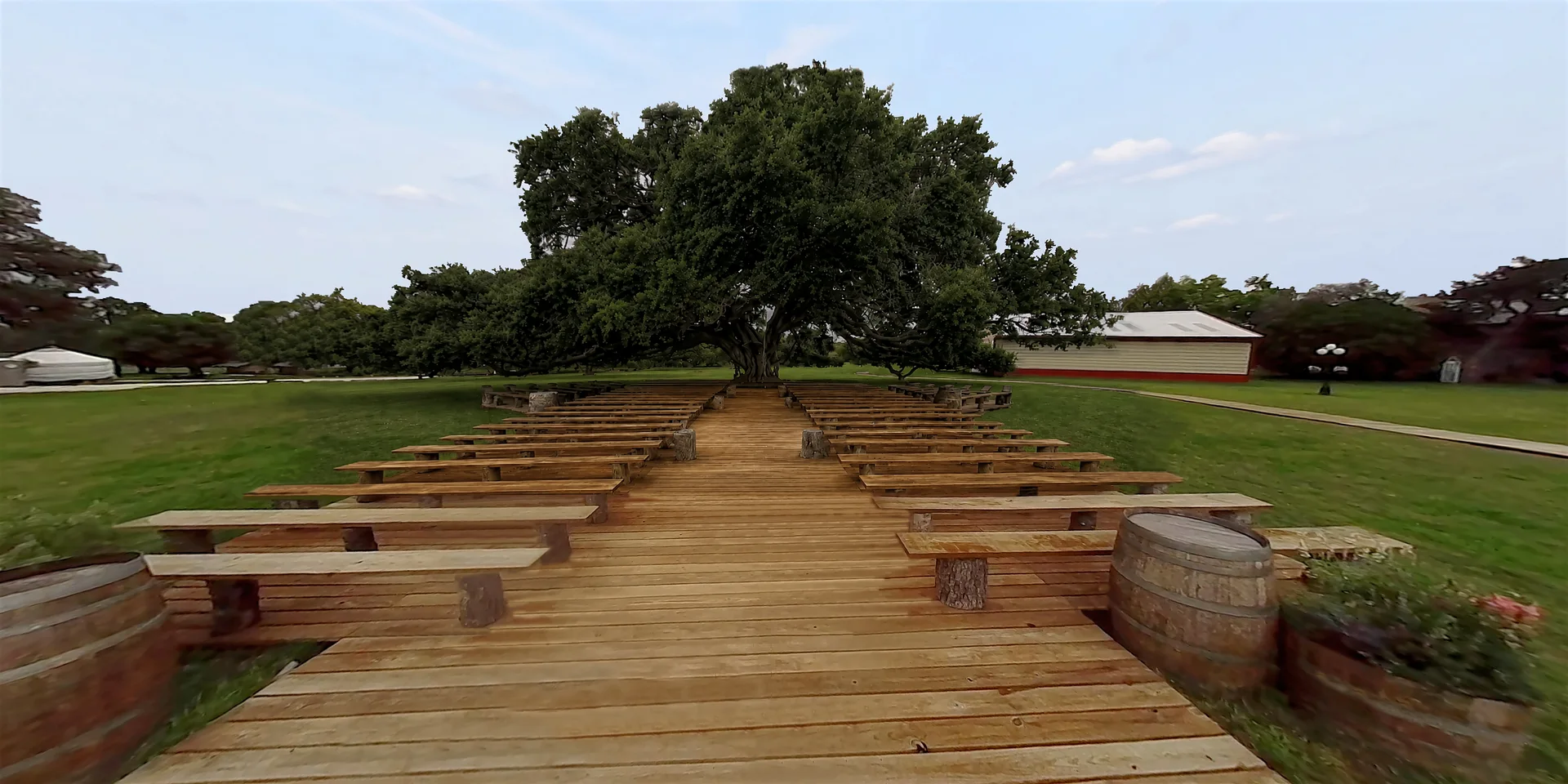 The boardwalk aisle beneath the live oak at Twin Oaks Resort