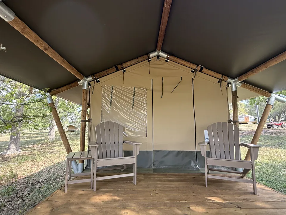 Porch outside a canvas glamping tent
